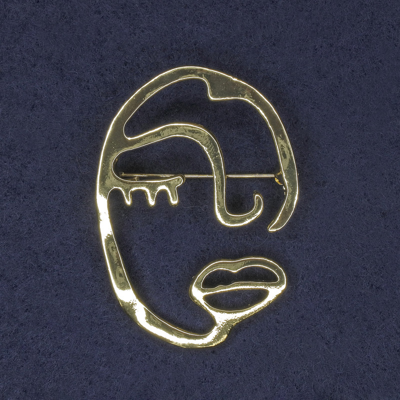 Broche 'Acento Cara' 34x47 mm ± metal dorado