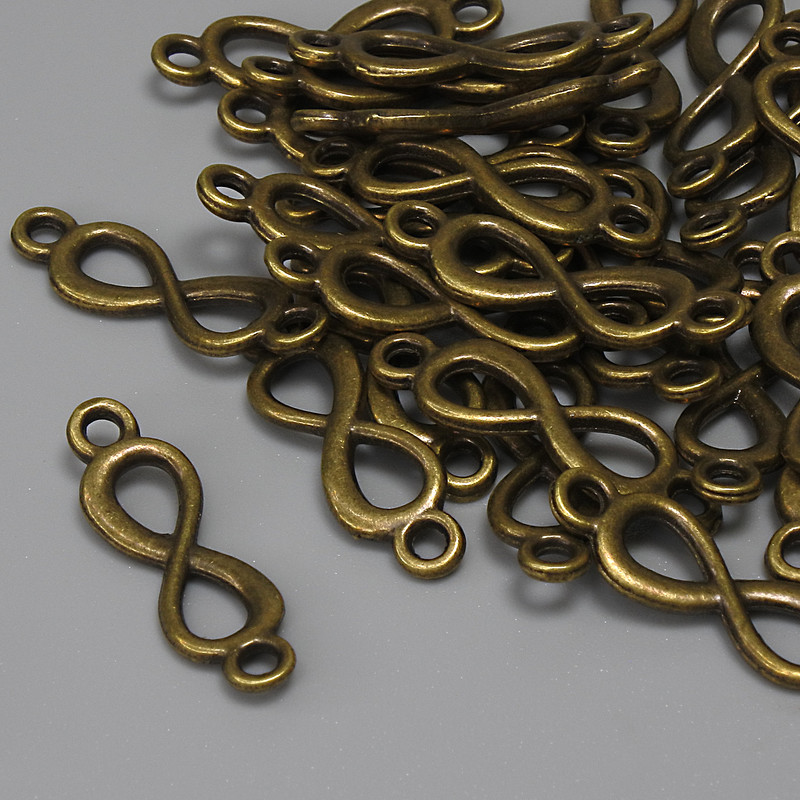 Conector Infinidad color bronce 20×6 mm ± empaque 29 piezas+